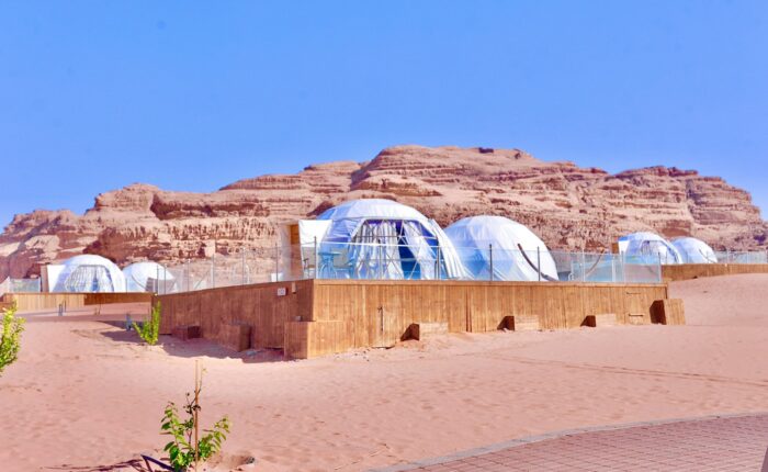 a desert area with several domes in the middle of it
